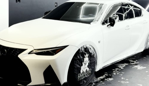 Lexus IS 350 F Sport in satin white, in the Obsidian Wrapz bay