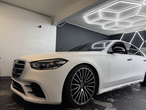 Satin white S-Class in the Obsidian Wrapz bay